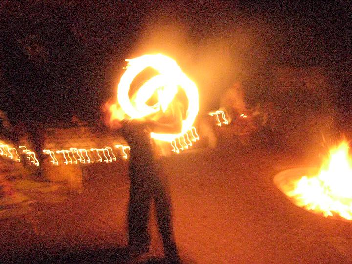 Fire spinning ceremony at night