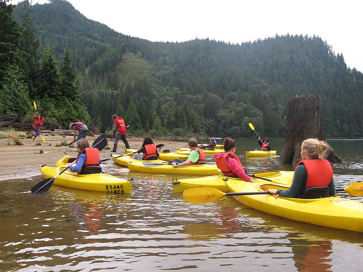Youth kayaking on a mountain lake